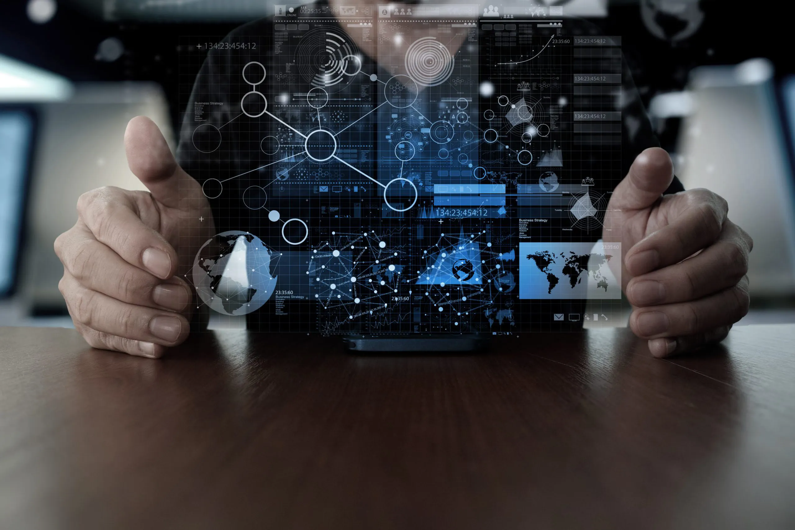 A hand using a mobile phone with a digital data overlay